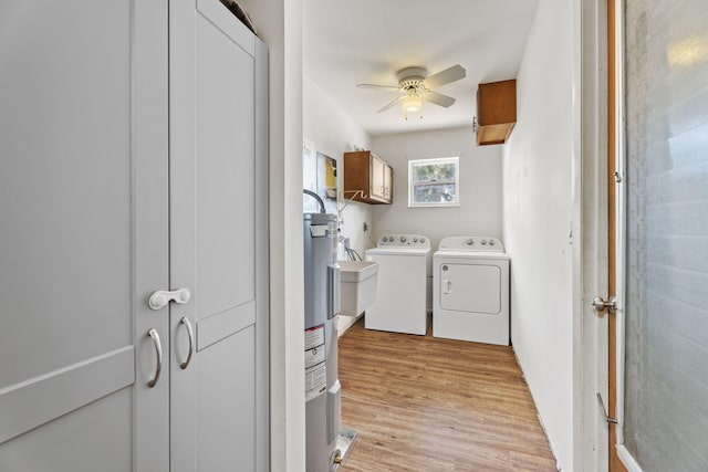 1728 SE Harrison St, Stuart, FL 34997 - washroom featuring ceiling fan, cabinet space, light wood finished floors, and independent washer and dryer