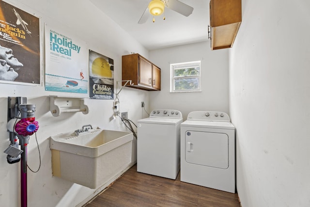 1728 SE Harrison St, Stuart, FL 34997 - washroom with cabinet space, independent washer and dryer, dark wood-style flooring, a sink, and a ceiling fan
