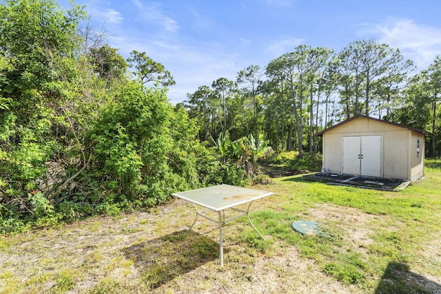 1728 SE Harrison St, Stuart, FL 34997 - view of yard featuring an outbuilding and a shed
