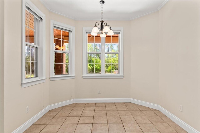 unfurnished dining area featuring baseboards, crown molding, light tile patterned floors, and a chandelier
