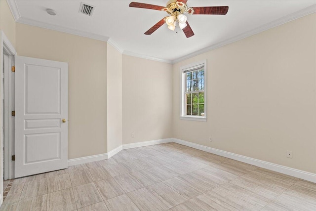 empty room with crown molding, ceiling fan, visible vents, and baseboards