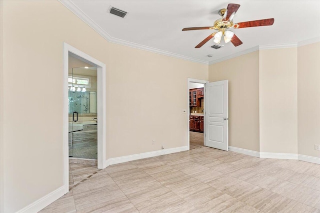spare room with crown molding, light tile patterned flooring, a ceiling fan, baseboards, and visible vents