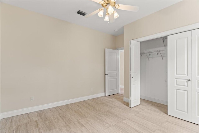 unfurnished bedroom featuring ceiling fan, visible vents, baseboards, and a closet