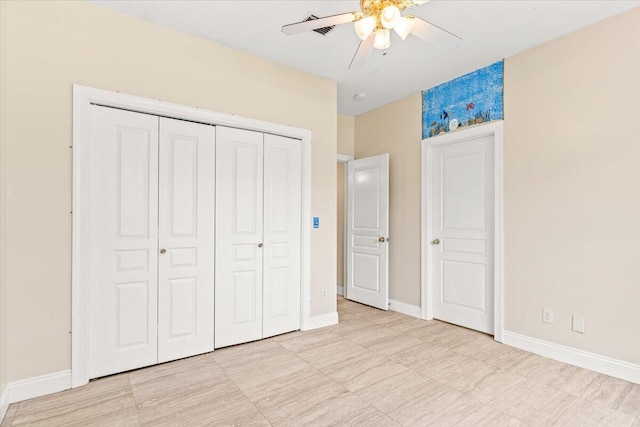 unfurnished bedroom featuring a closet, a ceiling fan, and baseboards