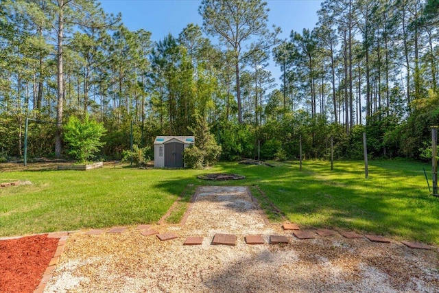 view of yard with an outbuilding and a shed