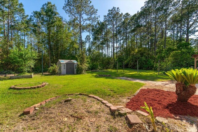 view of yard featuring an outbuilding and a shed