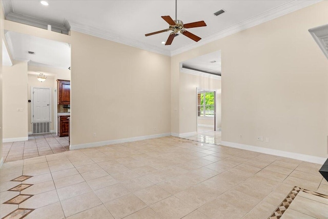 empty room featuring light tile patterned floors, baseboards, crown molding, and ceiling fan