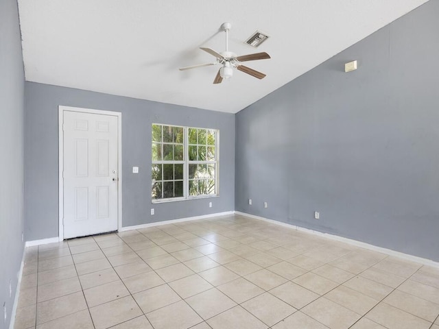 7745 99th Ct, Vero Beach, FL 32967 - empty room featuring light tile patterned floors, a ceiling fan, visible vents, vaulted ceiling, and baseboards