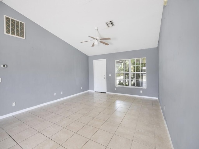7745 99th Ct, Vero Beach, FL 32967 - empty room featuring light tile patterned floors, visible vents, ceiling fan, baseboards, and vaulted ceiling