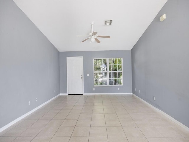 7745 99th Ct, Vero Beach, FL 32967 - unfurnished room with light tile patterned floors, ceiling fan, baseboards, visible vents, and lofted ceiling
