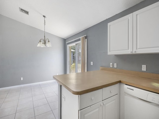 7745 99th Ct, Vero Beach, FL 32967 - kitchen featuring white cabinetry, visible vents, dishwasher, vaulted ceiling, and a peninsula