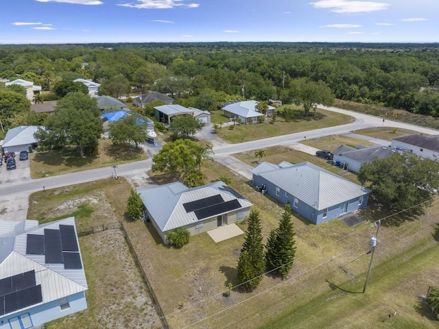 7745 99th Ct, Vero Beach, FL 32967 - birds eye view of property with a wooded view