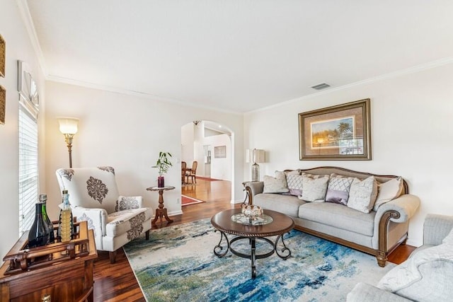 376 SW Quiet Woods, Port Saint Lucie, FL 34953 - living area with arched walkways, ornamental molding, wood finished floors, and visible vents