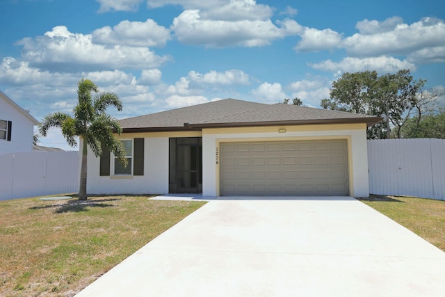 view of front of house with fence, a garage, and stucco siding