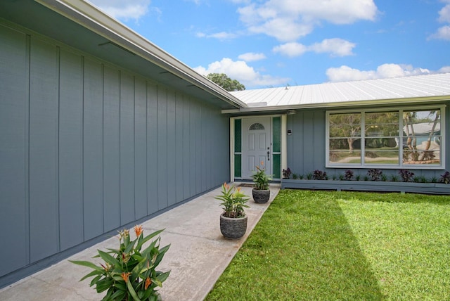 5620 SE Paramount Dr, Stuart, FL 34997 - doorway to property featuring a yard
