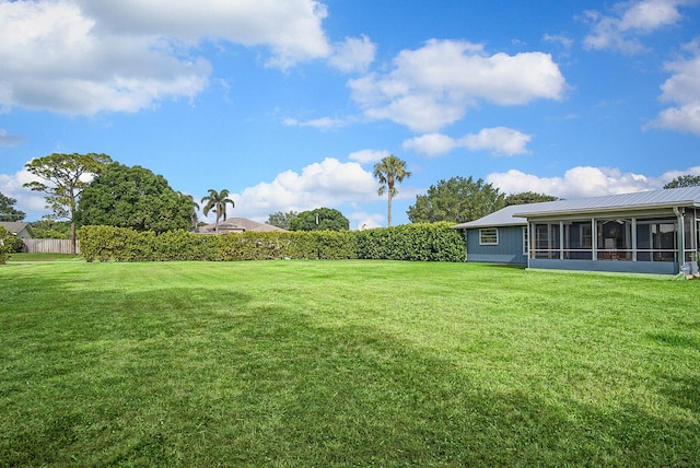 5620 SE Paramount Dr, Stuart, FL 34997 - view of yard with a sunroom