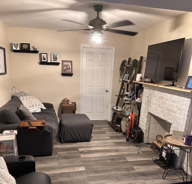 508 Palmetto St, West Palm Beach, FL 33405 - living area with a fireplace, wood finished floors, and ceiling fan