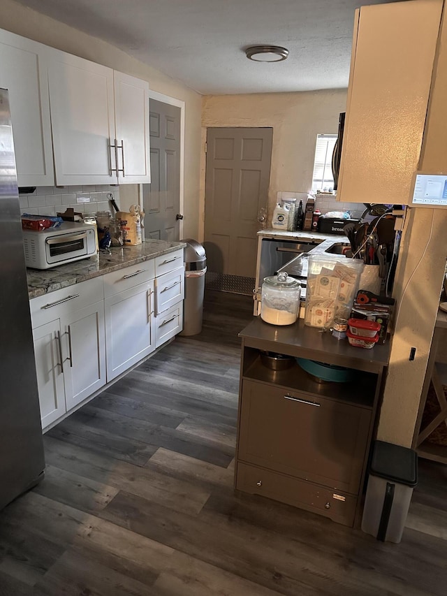 508 Palmetto St, West Palm Beach, FL 33405 - kitchen with white cabinets and dark wood-type flooring