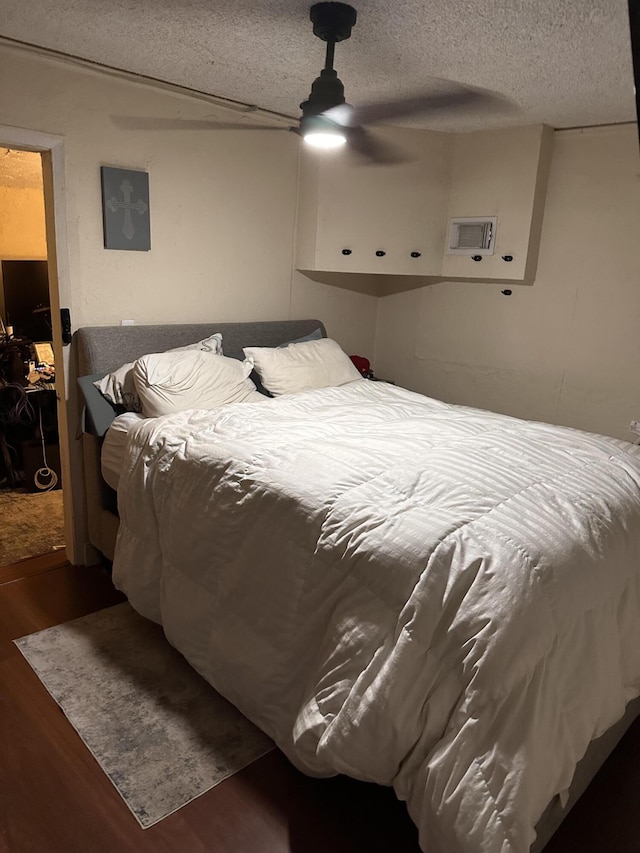 508 Palmetto St, West Palm Beach, FL 33405 - bedroom featuring wood finished floors, a textured ceiling, ceiling fan, and visible vents