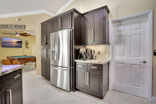 kitchen featuring stainless steel fridge, pool table, ornamental molding, and dark brown cabinetry