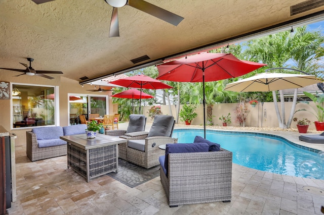 view of pool featuring a fenced in pool, a ceiling fan, a patio area, and a fenced backyard