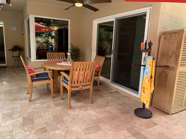 385 NW 37th Way, Deerfield Beach, FL 33442 - dining area with ceiling fan and stone tile flooring