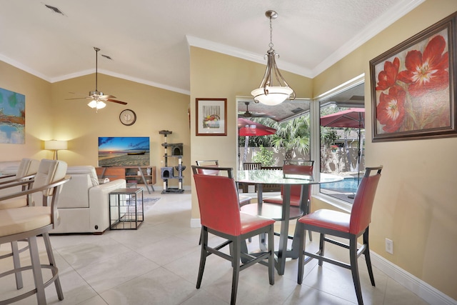 dining room featuring ceiling fan, visible vents, vaulted ceiling, baseboards, and light tile patterned flooring
