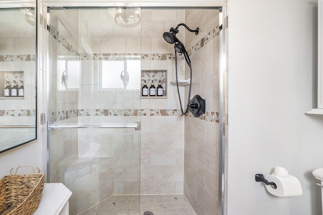 bathroom featuring a shower stall