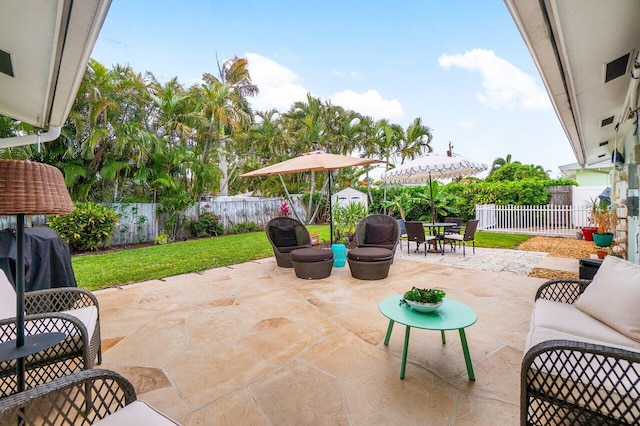 view of patio with a fenced backyard, outdoor dining area, and an outdoor living space