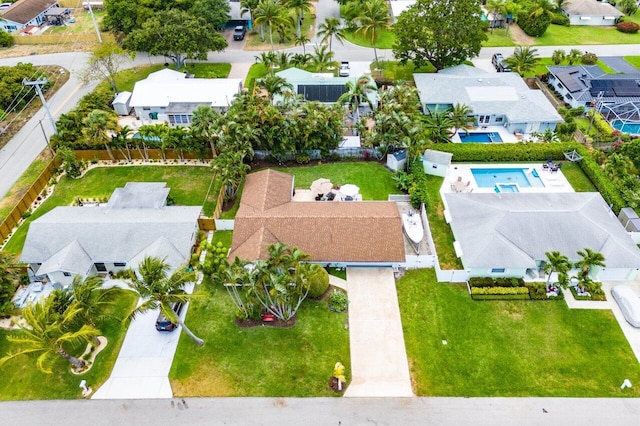 birds eye view of property with a residential view