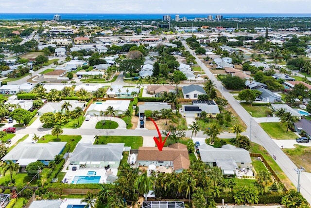 birds eye view of property with a residential view