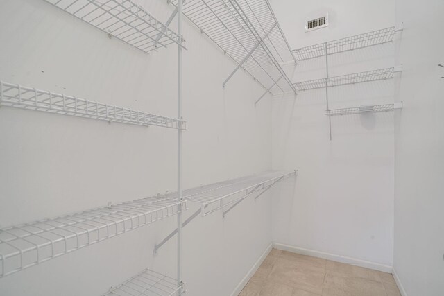 6209 Pond Tree Ct, Greenacres, FL 33463 - walk in closet with light tile patterned floors