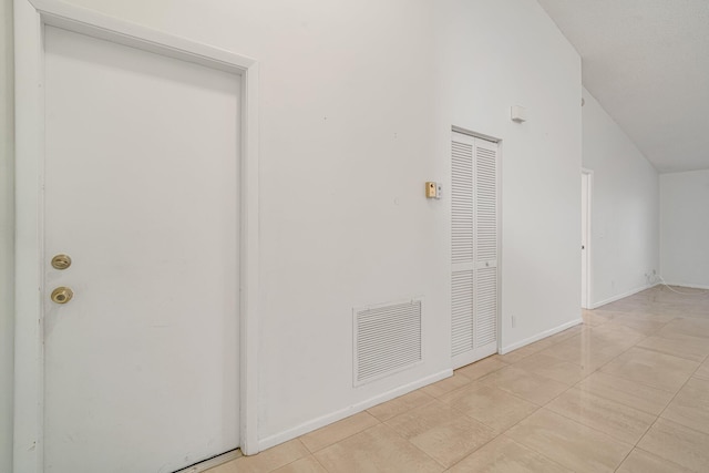 6209 Pond Tree Ct, Greenacres, FL 33463 - interior space with lofted ceiling, baseboards, and light tile patterned floors