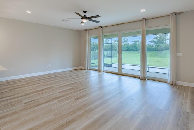 13509 SW Oceanus Blvd, Port Saint Lucie, FL 34987 - unfurnished room featuring baseboards, ceiling fan, light wood-style flooring, and recessed lighting