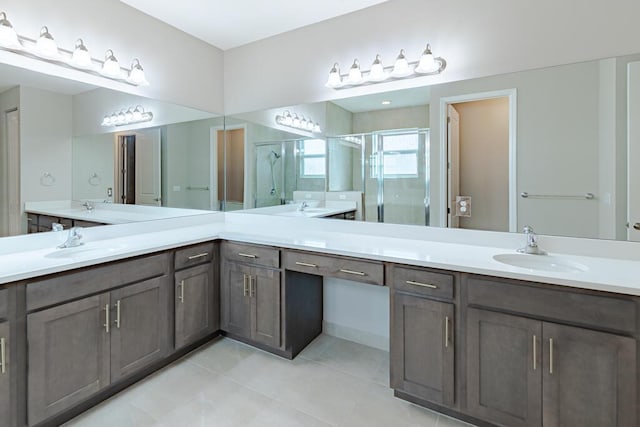 13509 SW Oceanus Blvd, Port Saint Lucie, FL 34987 - full bath featuring a shower stall, tile patterned flooring, and double vanity