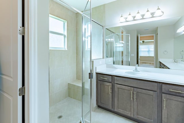13509 SW Oceanus Blvd, Port Saint Lucie, FL 34987 - bathroom featuring a stall shower, vanity, and tile patterned flooring