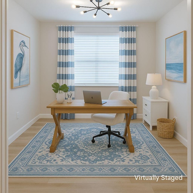 13509 SW Oceanus Blvd, Port Saint Lucie, FL 34987 - home office featuring light wood-style flooring, a chandelier, and baseboards