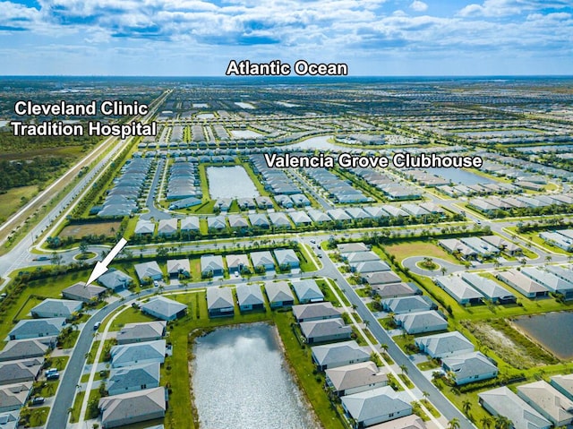 13509 SW Oceanus Blvd, Port Saint Lucie, FL 34987 - aerial perspective of suburban area featuring a large body of water