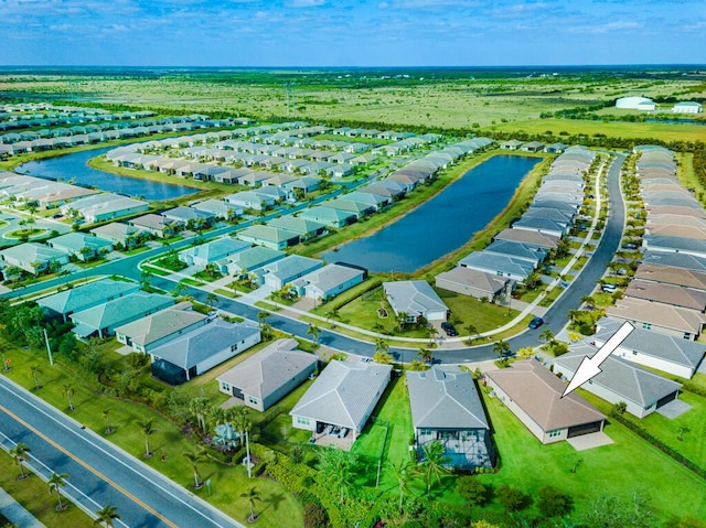 13509 SW Oceanus Blvd, Port Saint Lucie, FL 34987 - aerial perspective of suburban area featuring a nearby body of water