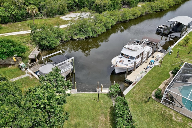 1904 6th Ave SE, Vero Beach, FL 32962 - view of dock featuring a lanai, a water view, and a lawn