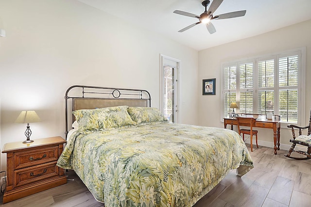 bedroom featuring baseboards, a ceiling fan, and wood finished floors