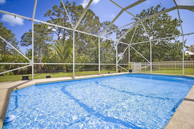 view of pool featuring fence, a fenced in pool, and a lanai