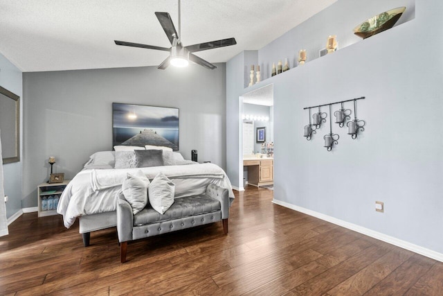 13029 Meadowbreeze Dr, Wellington, FL 33414 - bedroom with vaulted ceiling, wood finished floors, a ceiling fan, ensuite bath, and baseboards