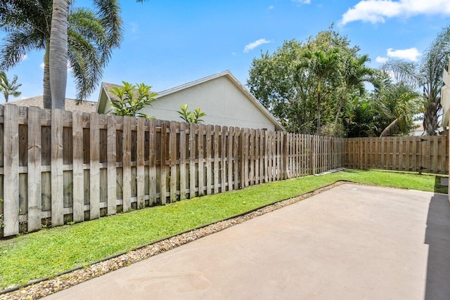 13029 Meadowbreeze Dr, Wellington, FL 33414 - view of patio with a fenced backyard