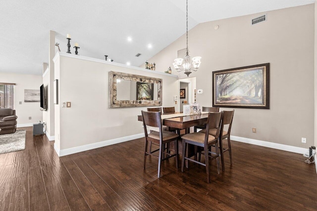 13029 Meadowbreeze Dr, Wellington, FL 33414 - dining area with lofted ceiling, wood finished floors, visible vents, and an inviting chandelier