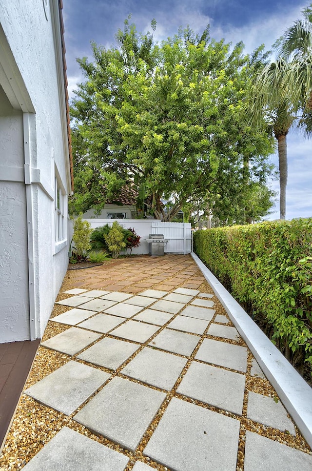 17744 Candlewood Ter, Boca Raton, FL 33487 - view of patio / terrace featuring fence