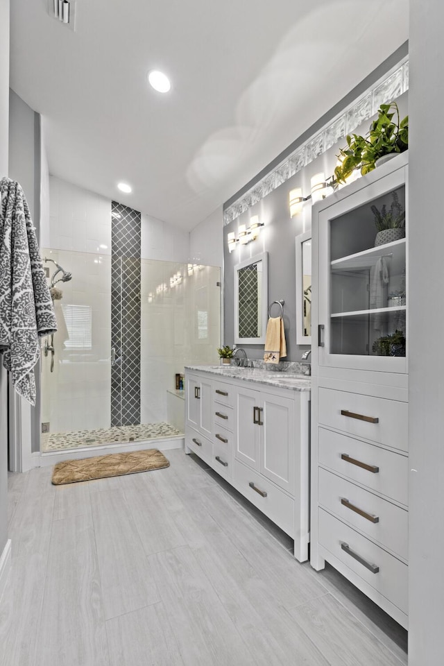 17744 Candlewood Ter, Boca Raton, FL 33487 - bathroom featuring vanity, walk in shower, recessed lighting, and wood finished floors