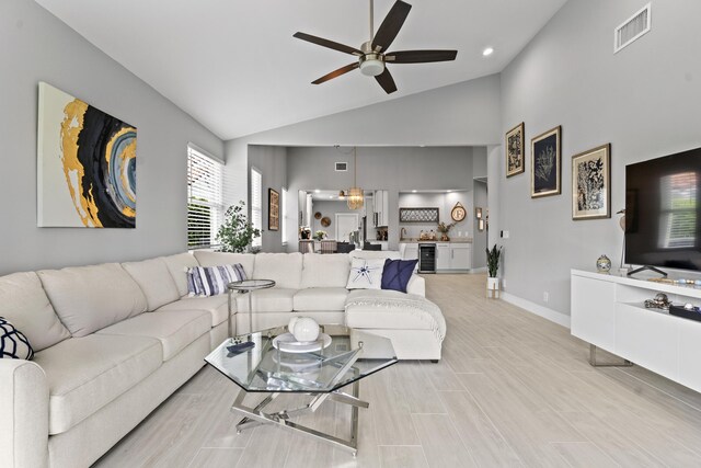 17744 Candlewood Ter, Boca Raton, FL 33487 - living area with visible vents, baseboards, beverage cooler, ceiling fan, and high vaulted ceiling