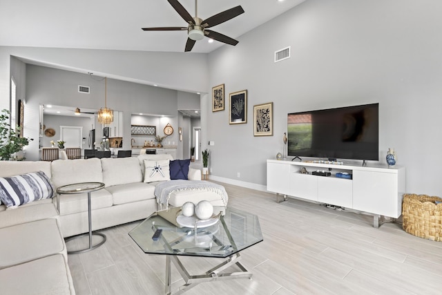 17744 Candlewood Ter, Boca Raton, FL 33487 - living area with ceiling fan, visible vents, baseboards, and high vaulted ceiling