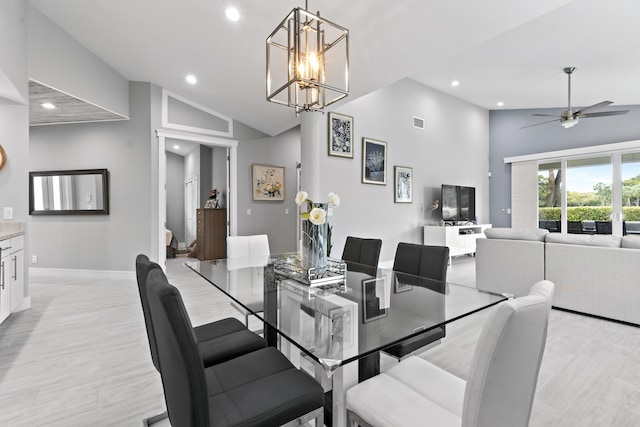 17744 Candlewood Ter, Boca Raton, FL 33487 - dining space featuring visible vents, baseboards, high vaulted ceiling, recessed lighting, and ceiling fan with notable chandelier